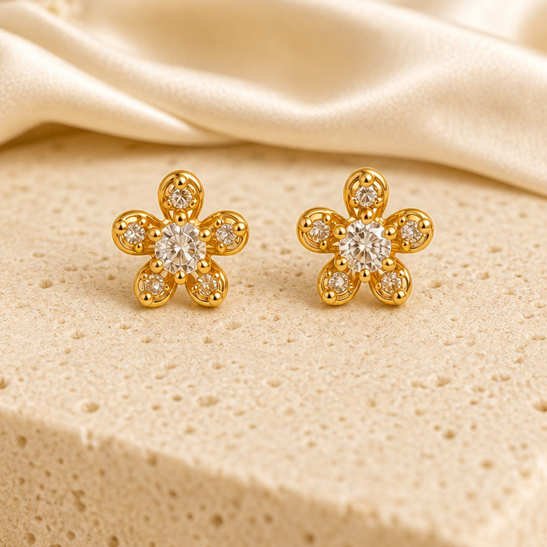 Example pair from the earrings combo: star-flower studs (designs vary)