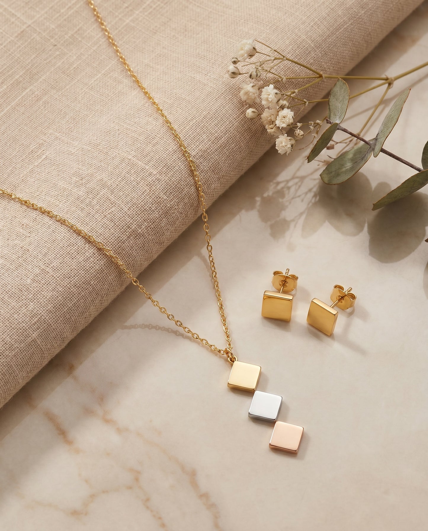 Tri-Tone Rhombus Necklace Set - styled flat lay