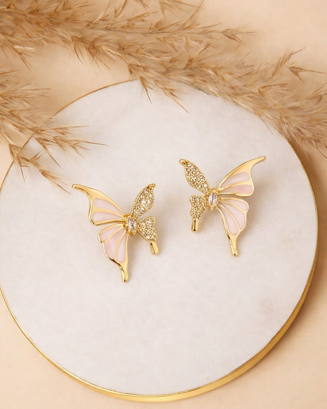White enamel and stone butterfly stud earings