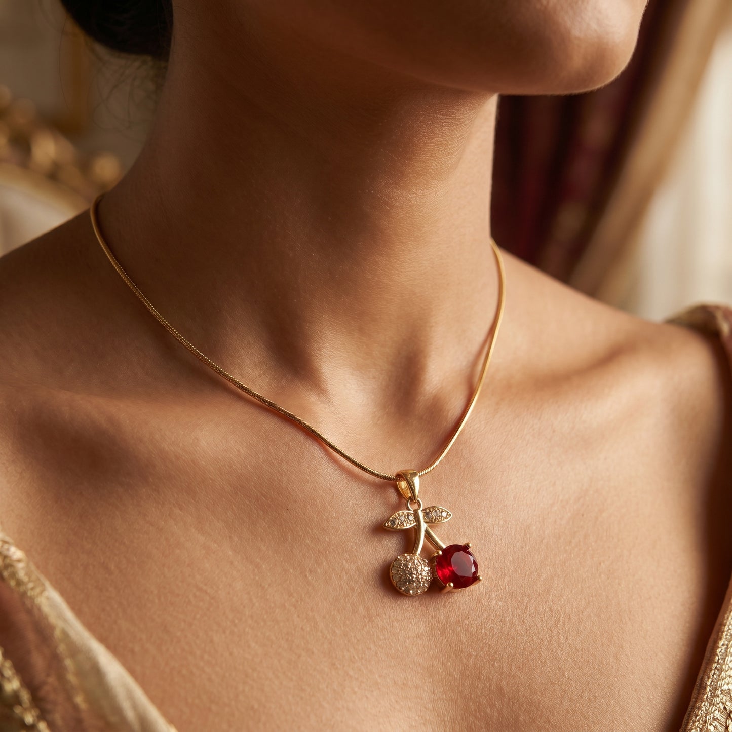 Cherry pendant necklace worn on neckline
