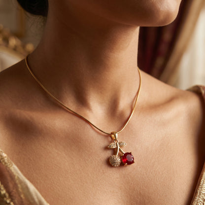 Cherry pendant necklace worn on neckline