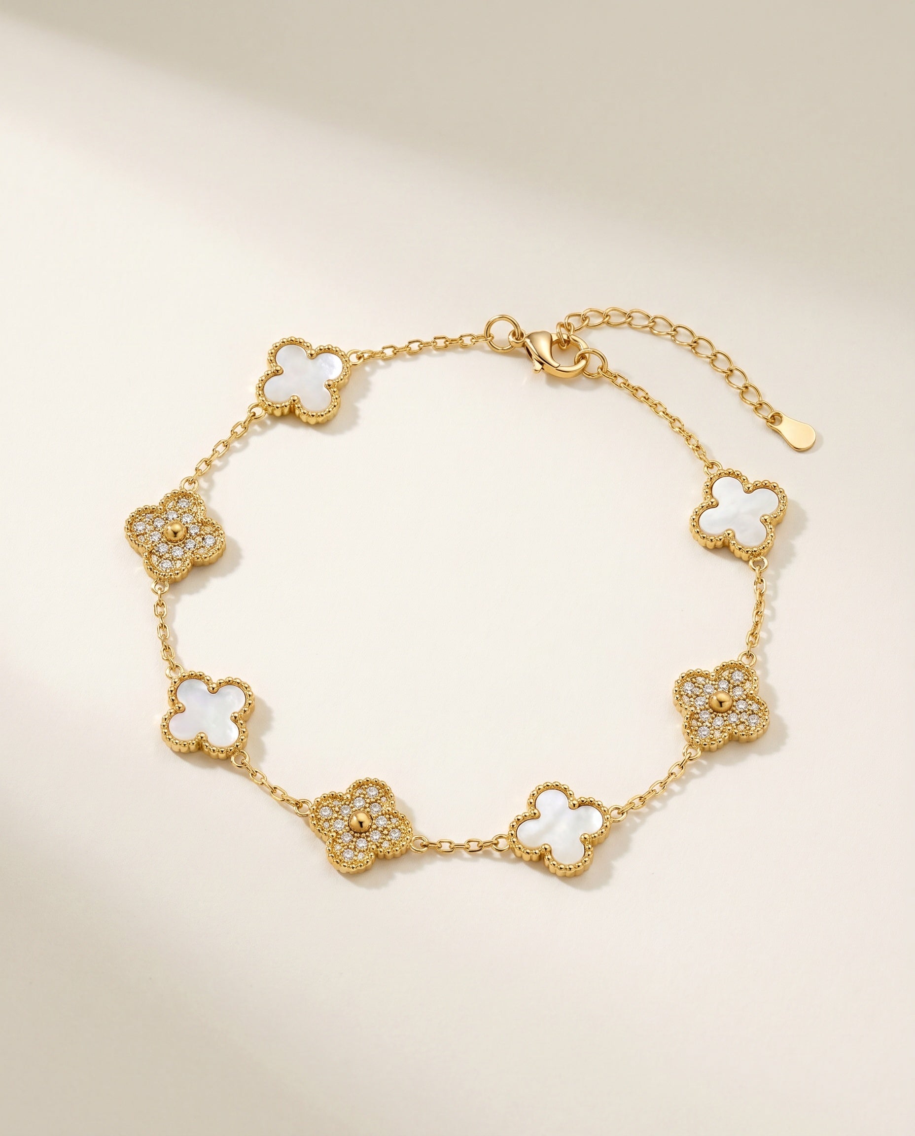 Mother-of-Pearl Clover Bracelet - gold chain with alternating mother-of-pearl and crystal clover motifs