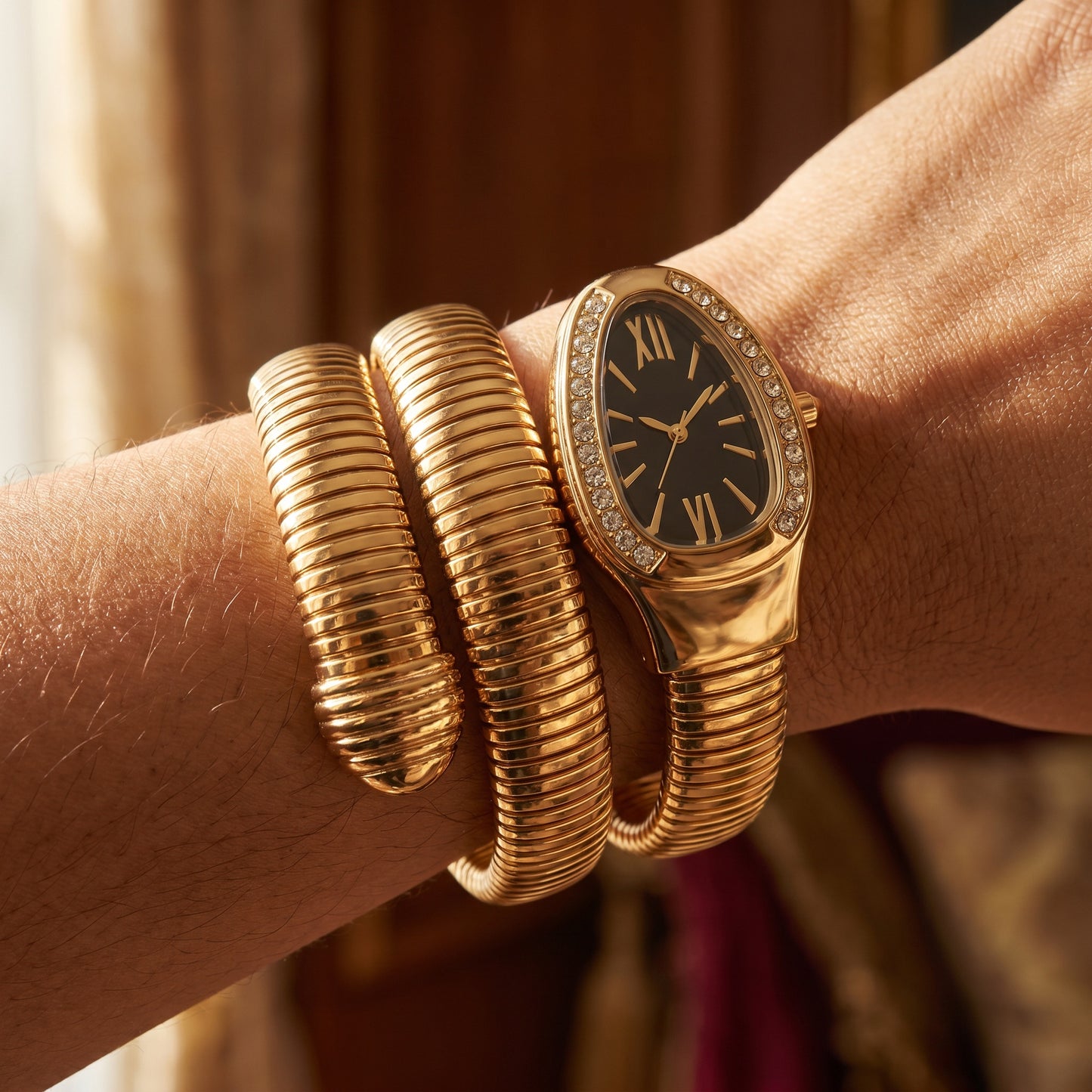 Black snake watch bracelet coiled on wrist