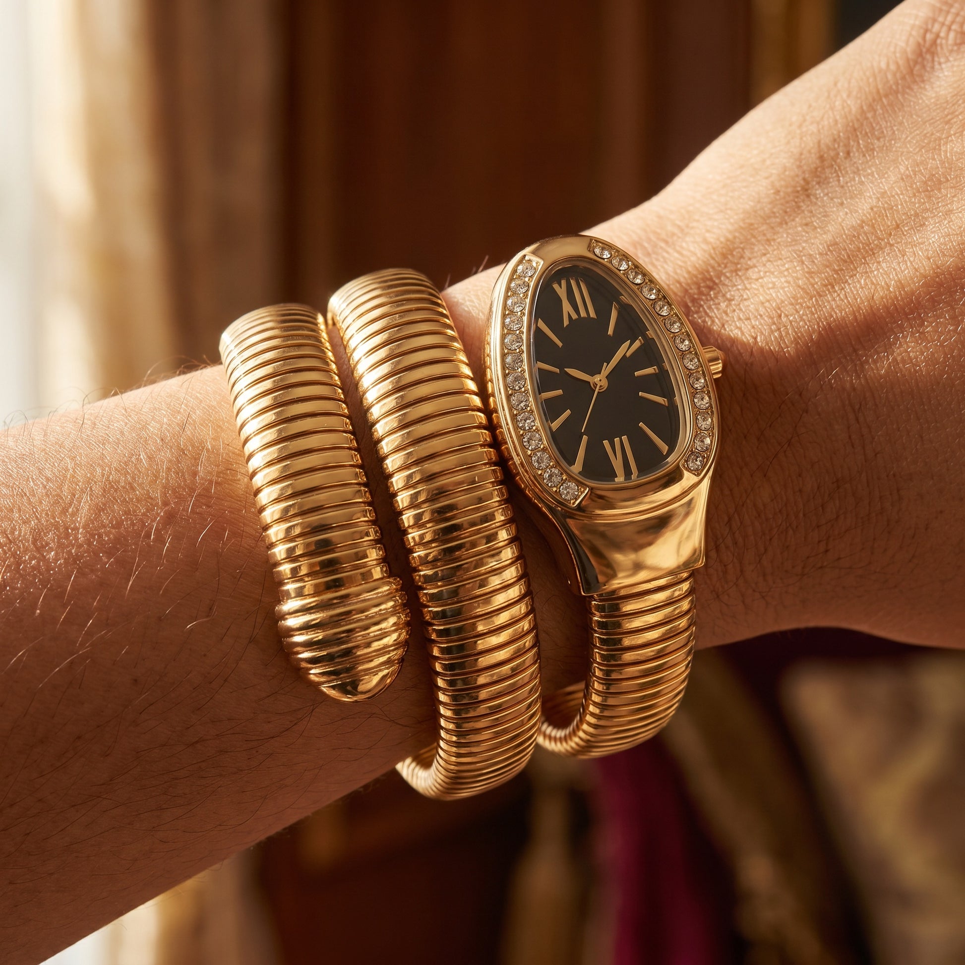 Black snake watch bracelet coiled on wrist
