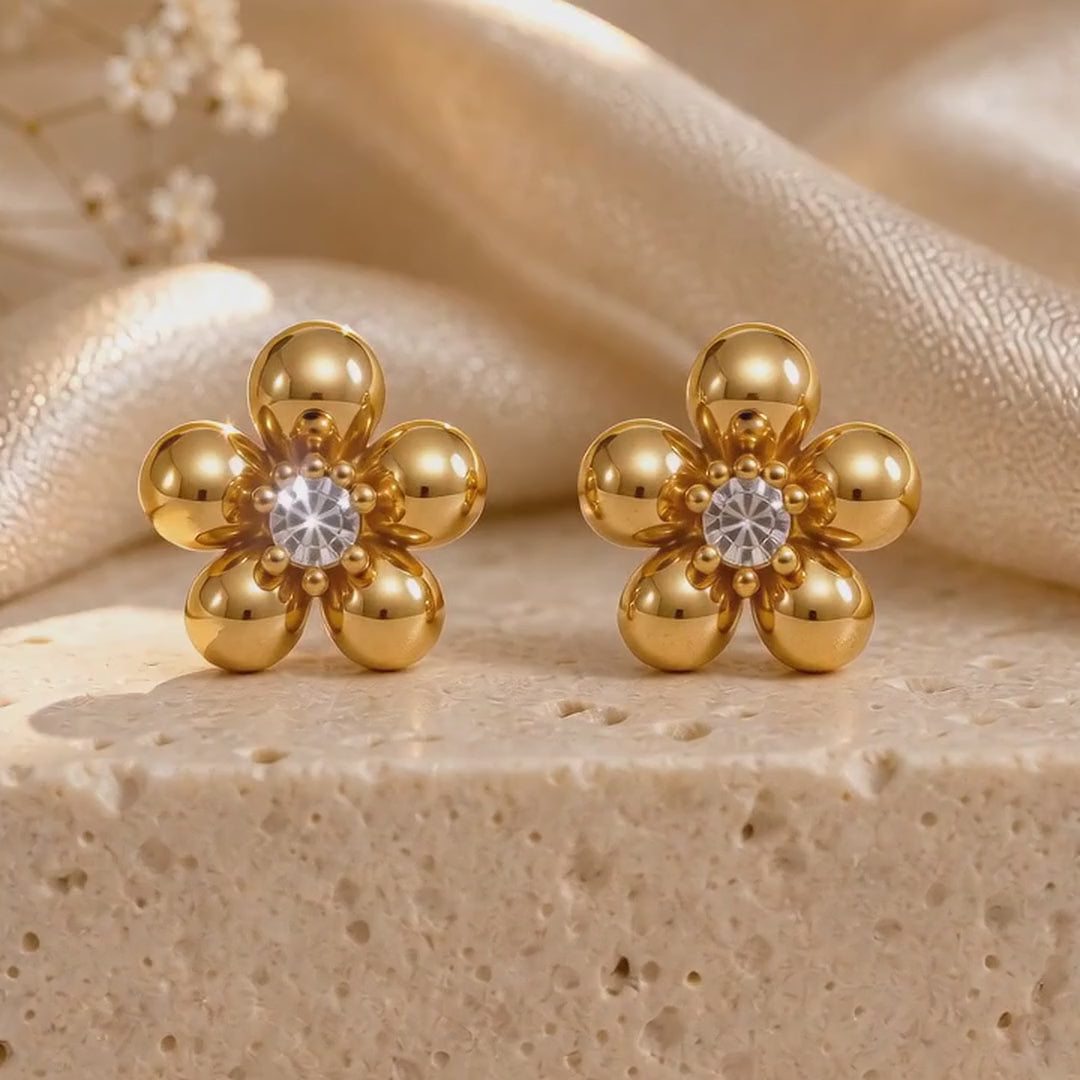 Gold-plated stud earrings from the combo, one pair at a time (designs vary)