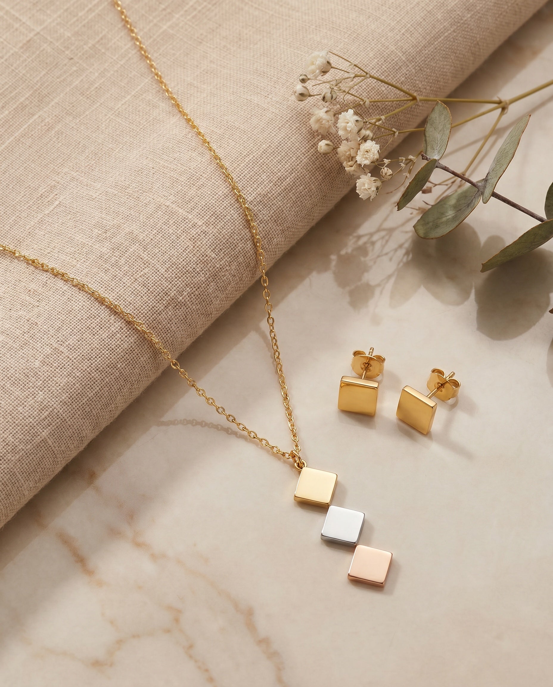 Tri-Tone Rhombus Necklace Set - styled flat lay