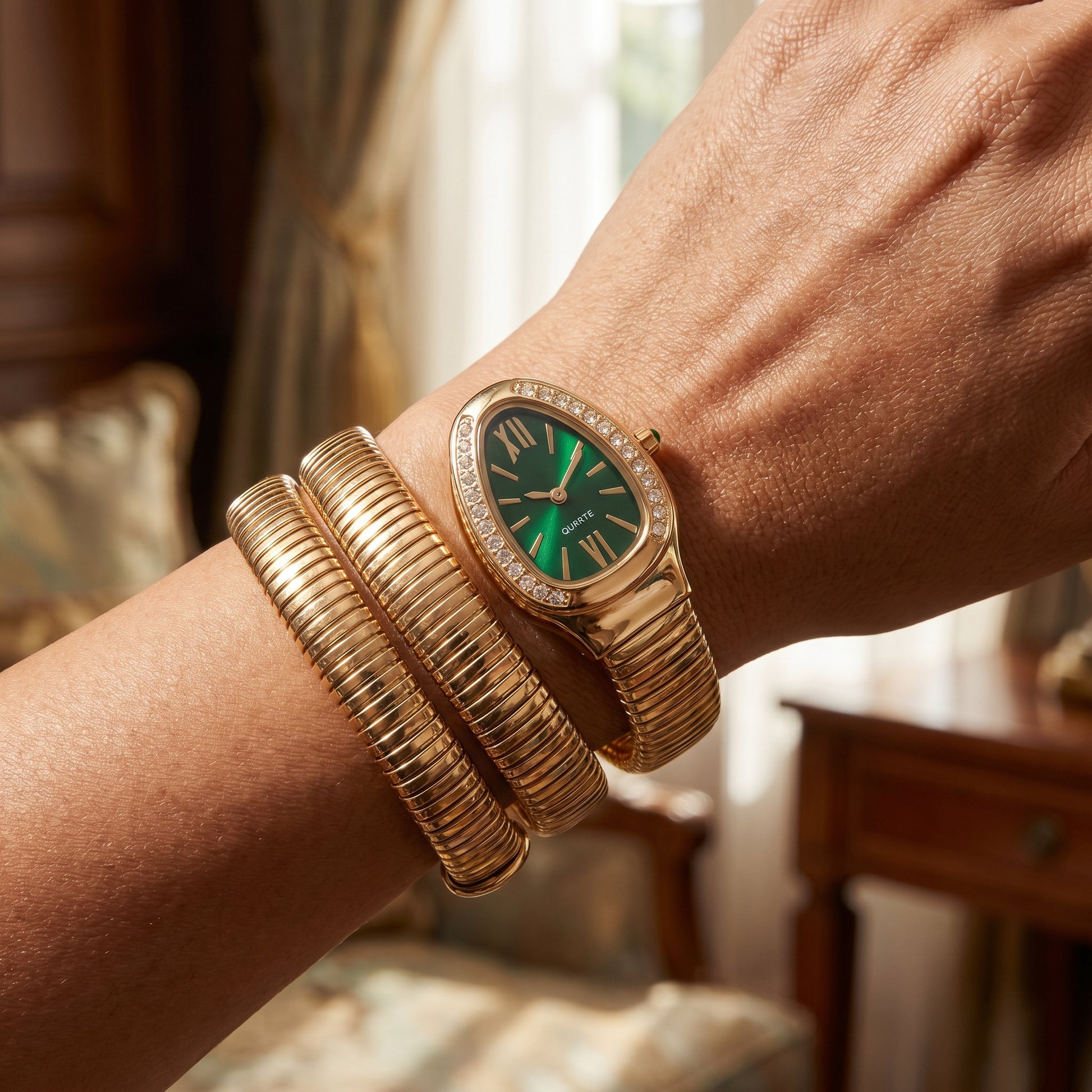 Snake watch bracelet coiled on wrist