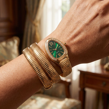 Snake watch bracelet coiled on wrist